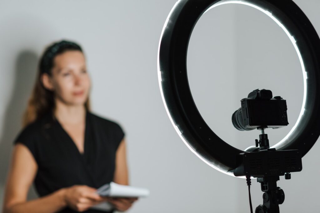 woman in front of camera and light