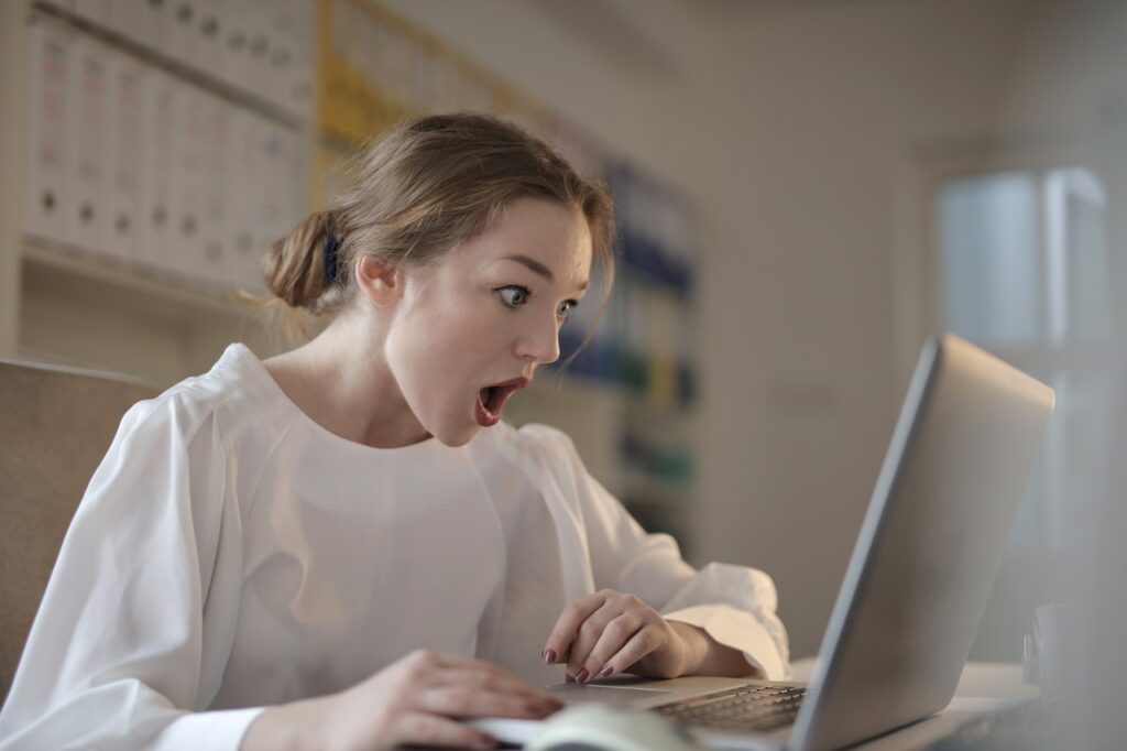 Shocked women in front of laptop