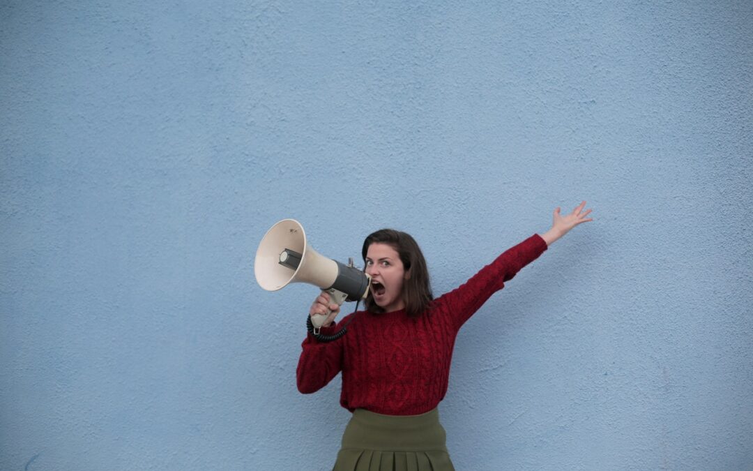 Woman shouting with megaphone