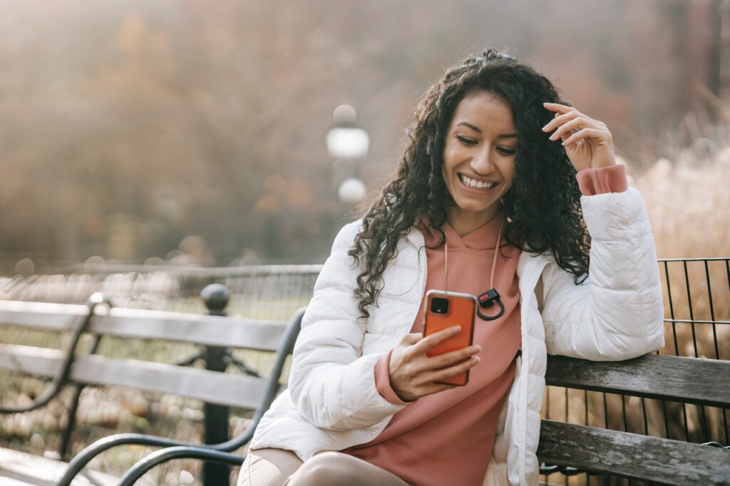 Girl looking at phone smiling