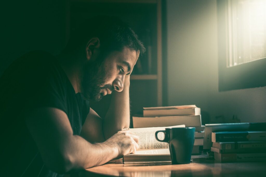 Man staring at an open book