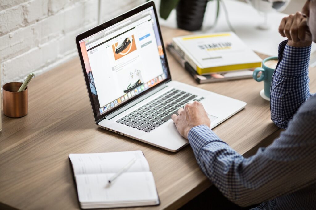 Man typing on laptop at desk