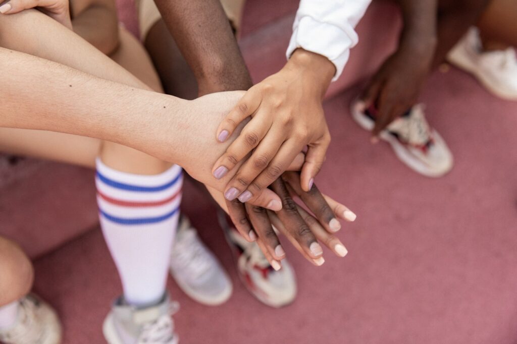 Group of people holding hands